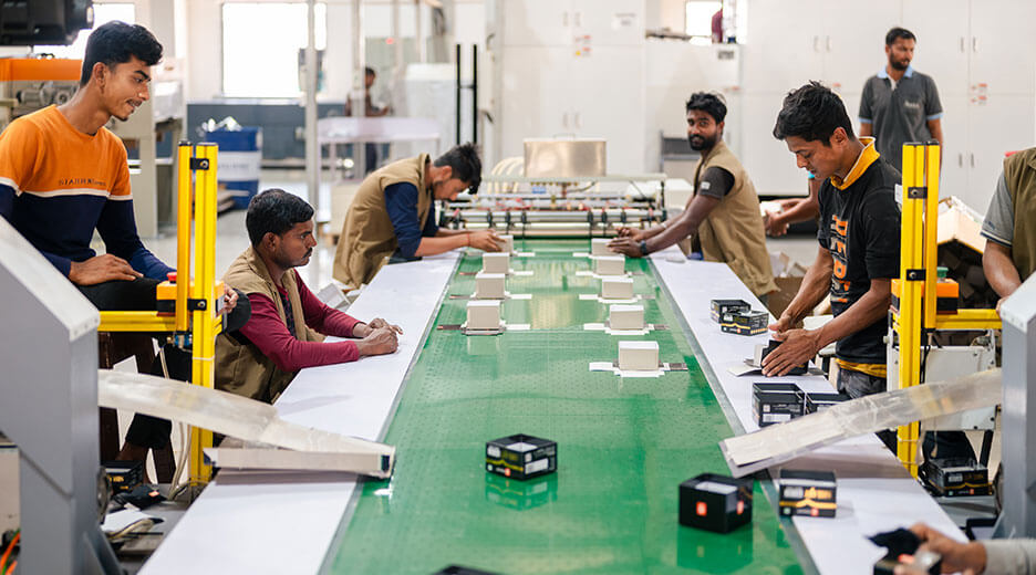 Workers are working on AMBA offset printing solution company in Ahmedabad